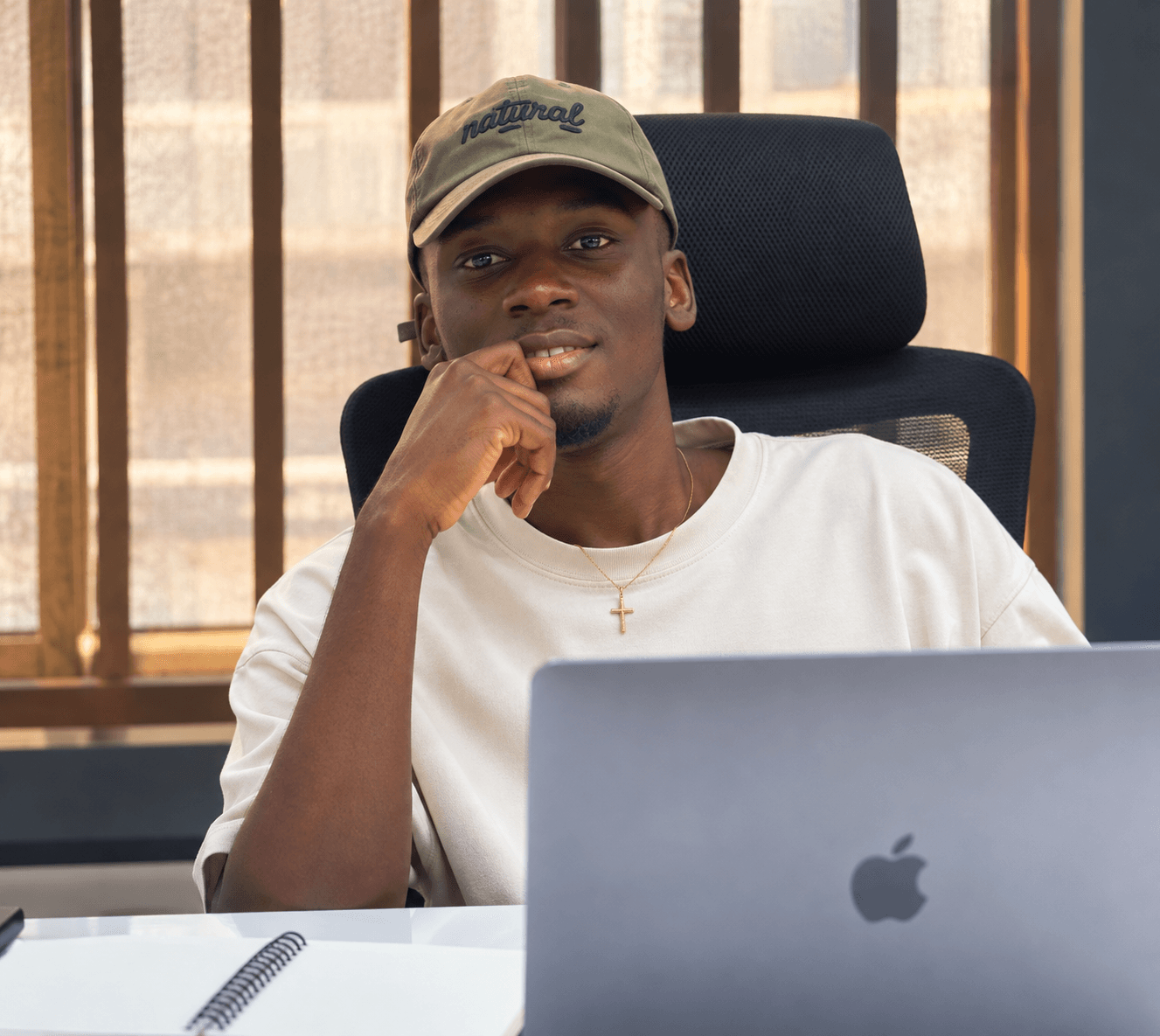 Demilade Folarin working in a technology workspace